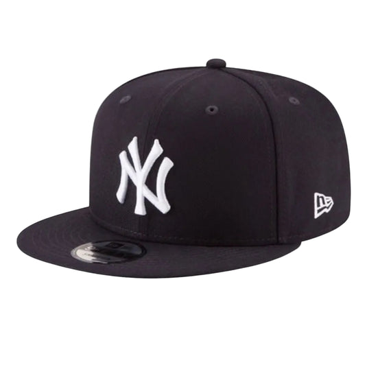 A black New York Yankees 9FIFTY fitted cap by New Era, featuring a white embroidered NY logo on the front and a white New Era flag logo on the side, set against a plain white background.