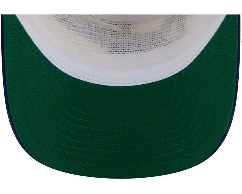 Load image into Gallery viewer, Close-up of a trucker-style baseball cap showing the curved green brim, white fabric trim, and white mesh back panels.

