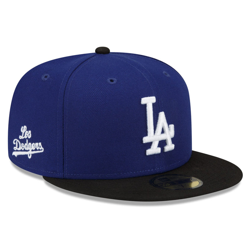 Load image into Gallery viewer, Blue and black baseball cap with white logo on a white background
