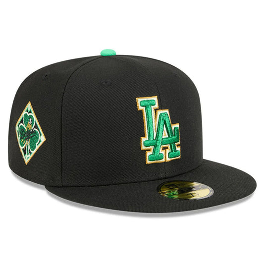 Black baseball cap with green and gold LA logo and a shamrock patch on a white background.