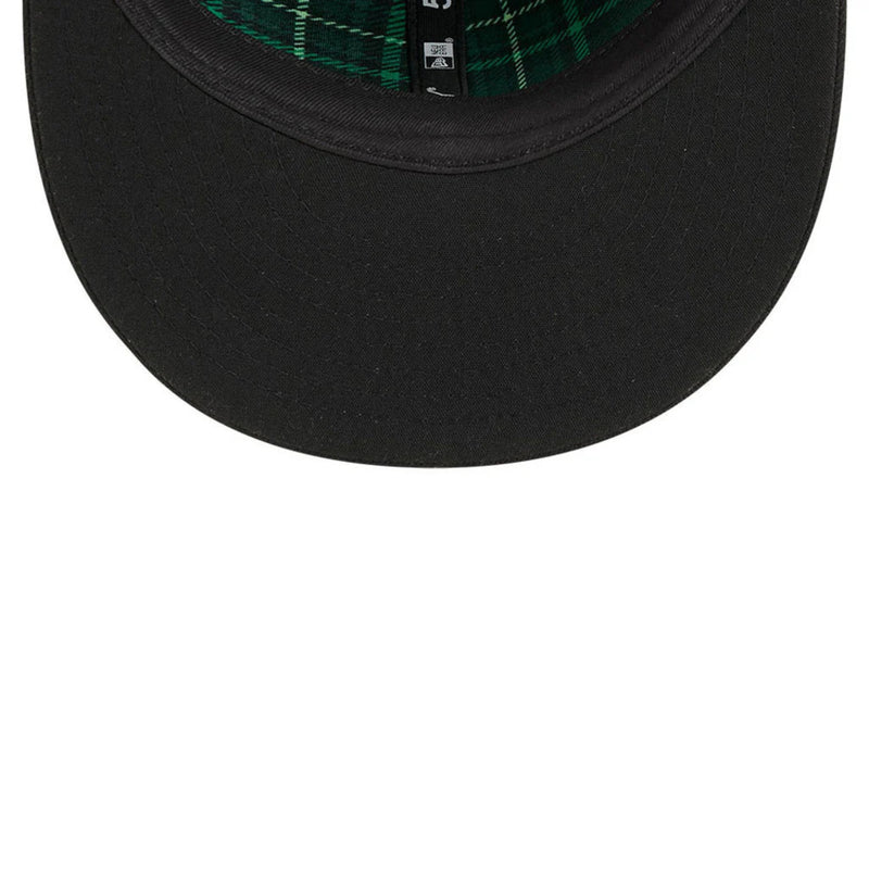 Load image into Gallery viewer, Black cap with plaid interior on a white background

