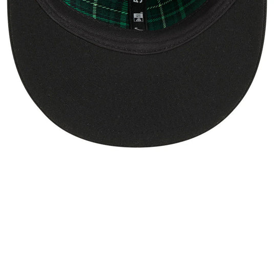 Black cap with plaid interior on a white background