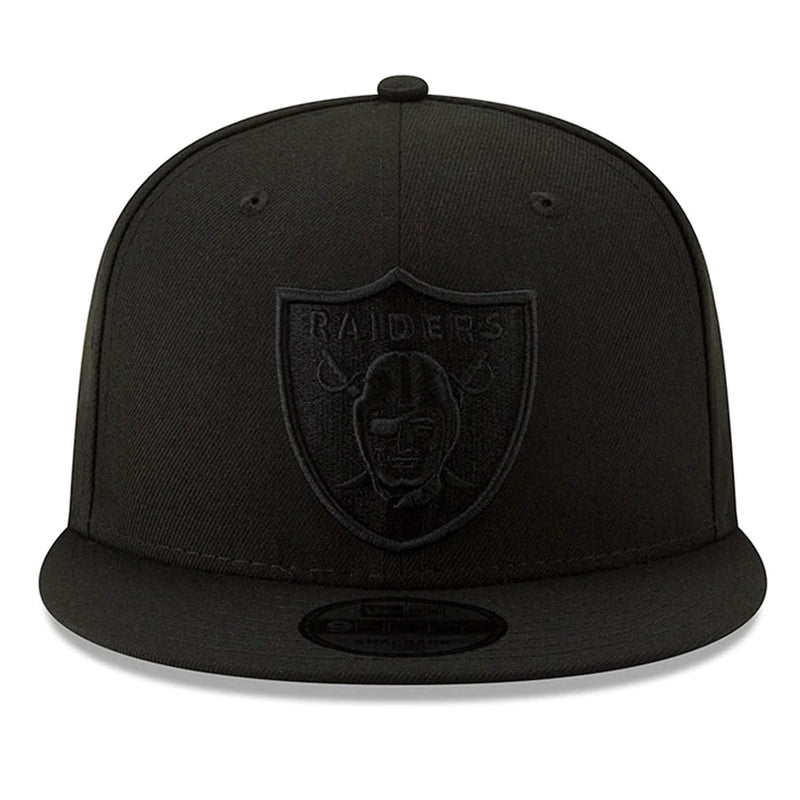 Load image into Gallery viewer, New Era Basic 9Fifty snapback cap with NFL team Las Vegas Raiders logo in black raised embroidery on a black crown.
