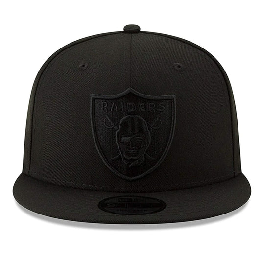 New Era Basic 9Fifty snapback cap with NFL team Las Vegas Raiders logo in black raised embroidery on a black crown.
