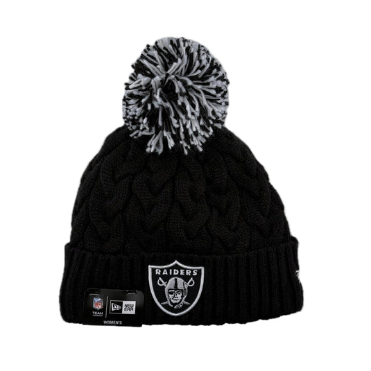New Era NFL Raiders Cable Knit Beanie with black and white pom-pom.  Warm fleece lining and stylish sparkly black cable knit weave. 