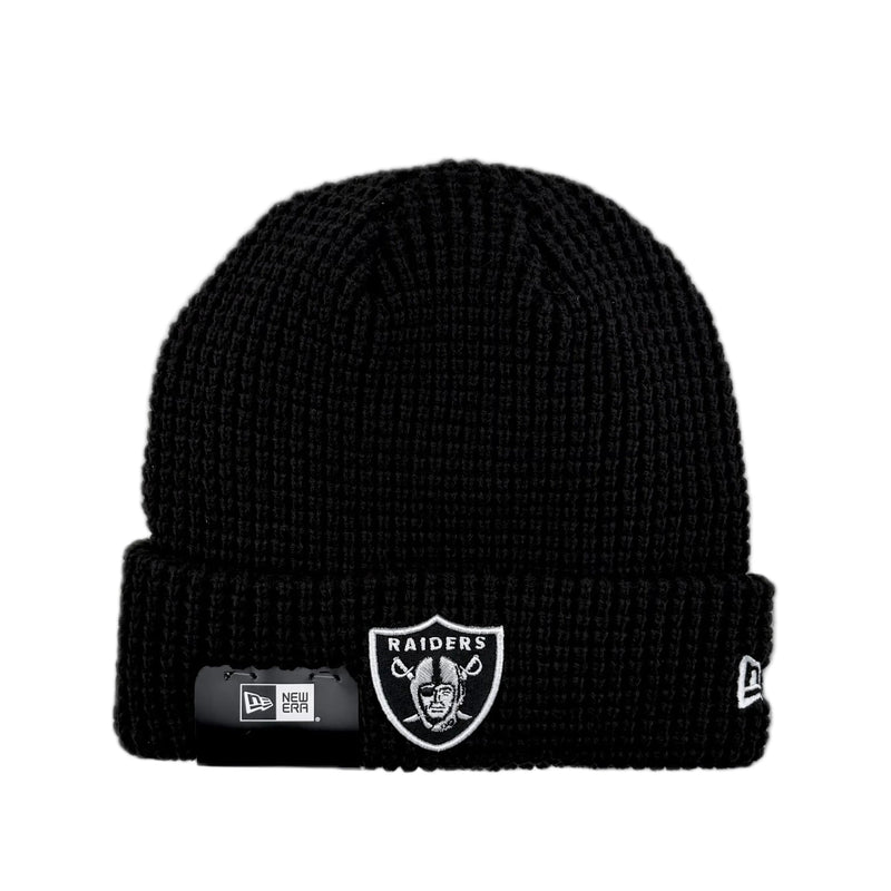 Load image into Gallery viewer, Black knit beanie with NFL team Raiders logo on the cuff and New Era logo on the side. 
