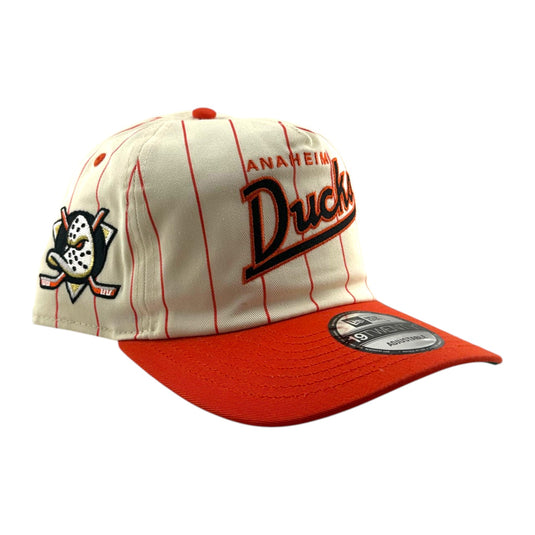 An Anaheim Ducks baseball cap featuring an off-white crown with thin orange pinstripes, a bright red curved brim, and the Anaheim Ducks logo embroidered on the front and side. A New Era 9FORTY sticker is visible on the brim.