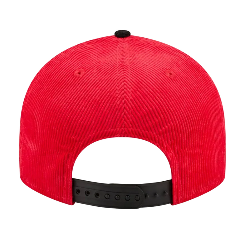 Load image into Gallery viewer, The back view of a bright red corduroy baseball cap with a black snapback closure strap on a white background.
