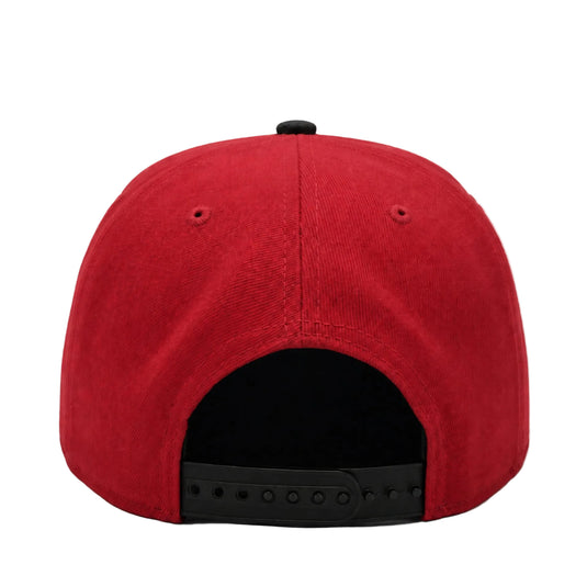 The back view of a red structured snapback cap with a black adjustable strap and black button on a white background.