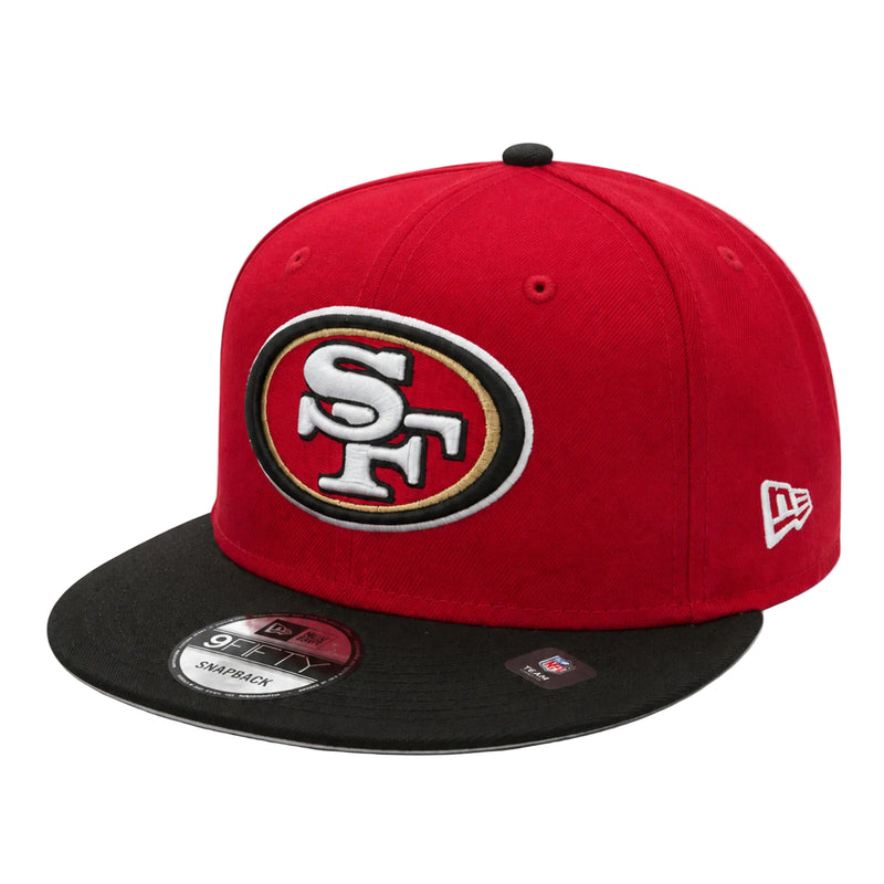 Load image into Gallery viewer, A red and black San Francisco 49ers snapback cap by New Era, featuring the team logo on the front and a white New Era flag on the side, set against a plain white background.
