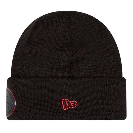 Side view of a black cuffed 49ers beanie with a red New Era logo patch sewn into the side of the cuff