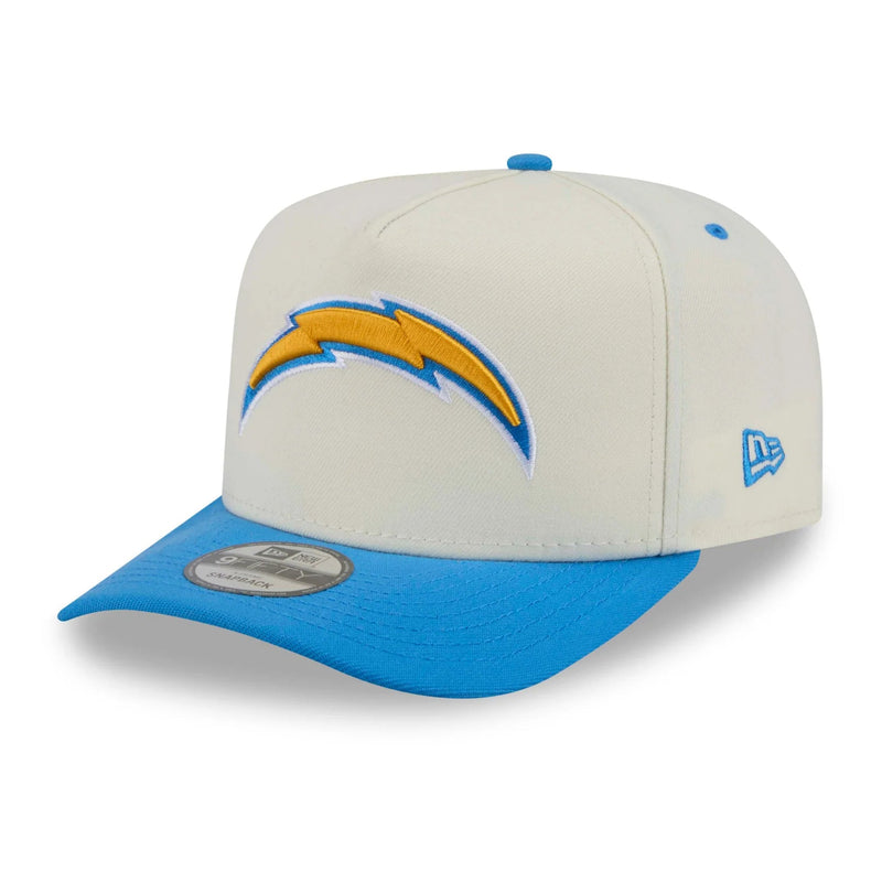Load image into Gallery viewer, A Los Angeles Chargers New Era 9FIFTY fitted cap featuring an off-white crown with a blue brim, a blue top button, and a yellow and blue lightning bolt logo on the front.
