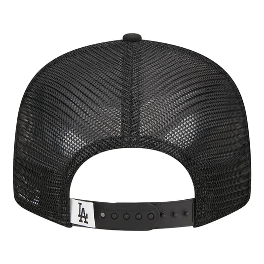 Black mesh cap with a white Dodgers logo on a white background