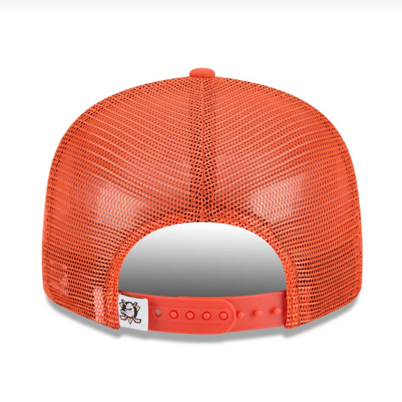 Load image into Gallery viewer, Orange mesh cap with a team logo tag on a white background. 
