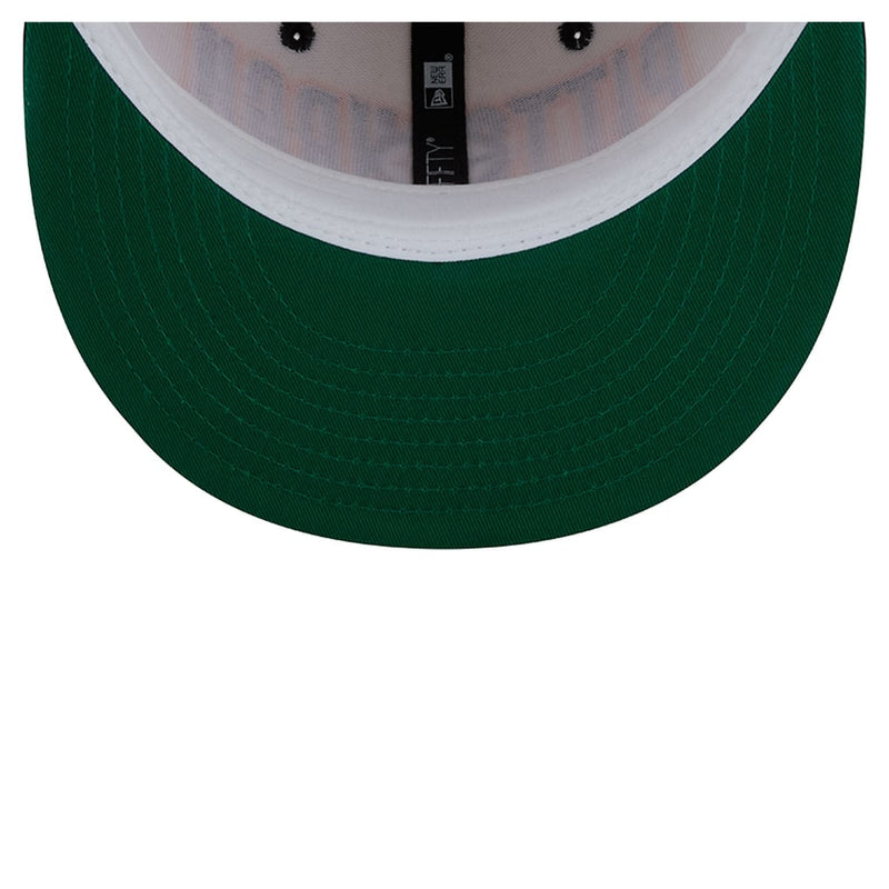 Load image into Gallery viewer, Close-up of the front brim of a baseball cap, showing a dark forest green fabric brim with a white curved inner band and a black adjustable strap with a visible New Era logo.
