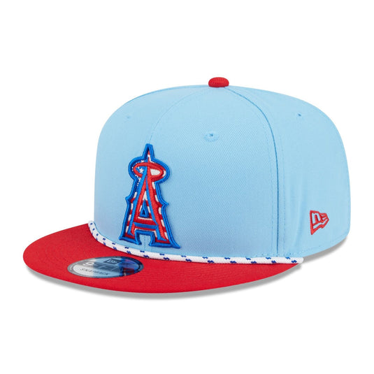 Blue and red Angels cap with an American flag themed logo and a red and white hat cord running across the visor. 