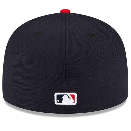 A navy blue baseball cap with a red button on top and a white, navy, and red MLB logo patch on the front, shown against a white background.
