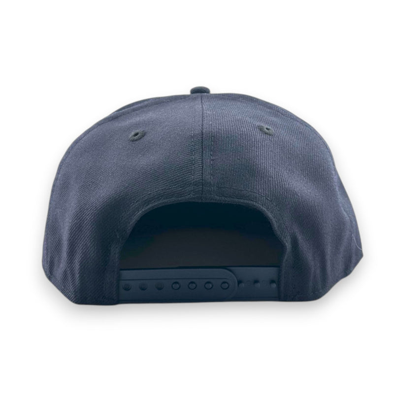Load image into Gallery viewer, Navy blue baseball cap with a snapback closure on a white background
