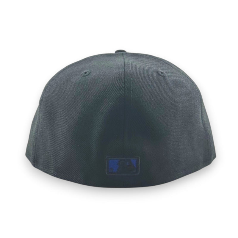 Load image into Gallery viewer, Black baseball cap with an MLB logo on the back against a white background
