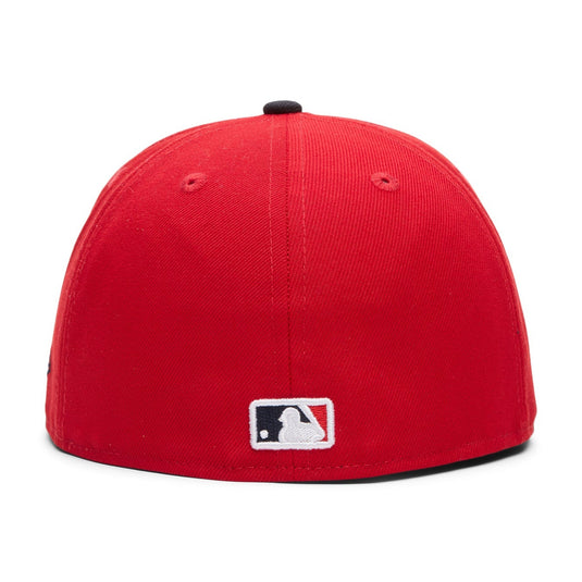 Red baseball cap with MLB logo on a white background