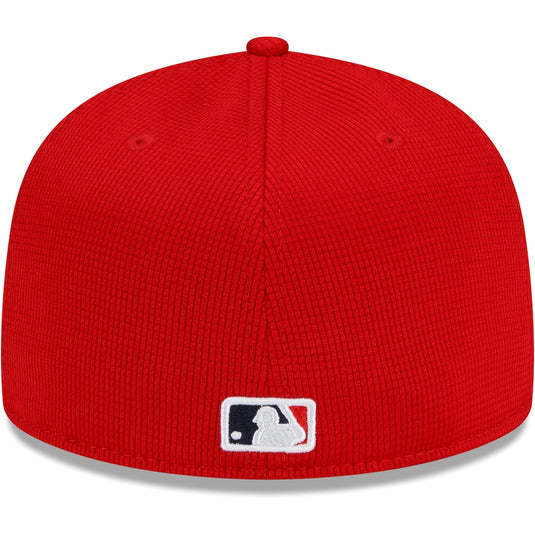 Red baseball cap with MLB logo on a white background