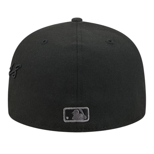 A black baseball cap featuring a tonal black embroidered Dodgers logo on the side and a tonal black MLB patch on the front, shown against a plain white background.