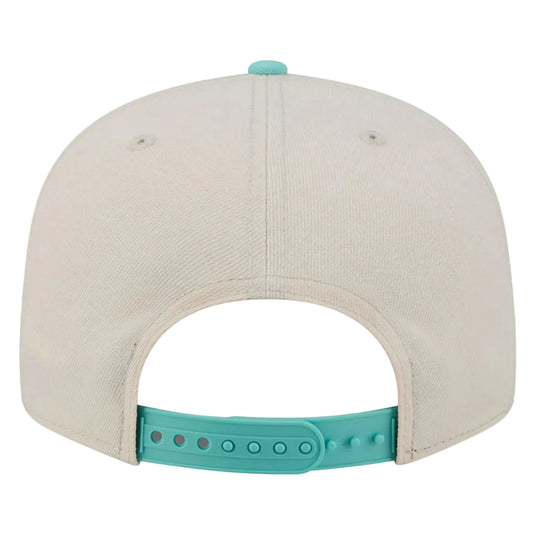 Back view of a baseball cap in off-white with a turquoise adjustable strap and matching top button, shown on a white background.