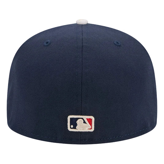 Navy blue baseball cap with MLB logo on a white background