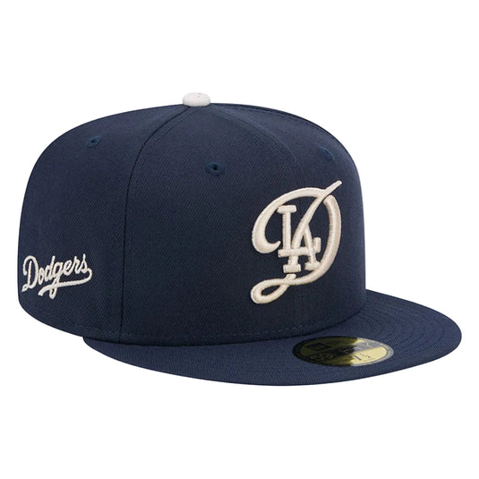 Navy blue baseball cap with 'Dodgers' logo on a white background