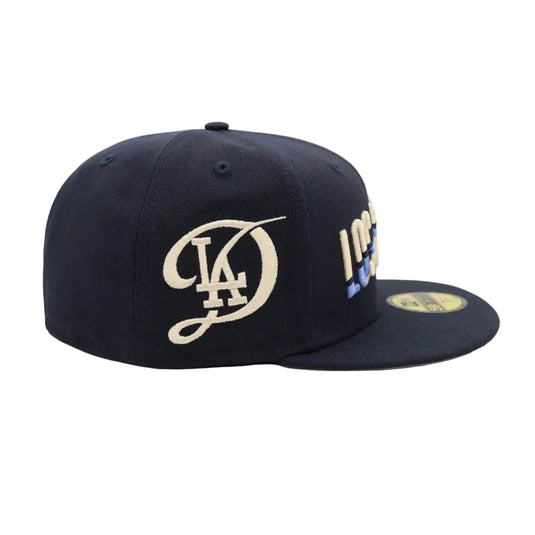 Navy blue cap with gold and white logo on a white background