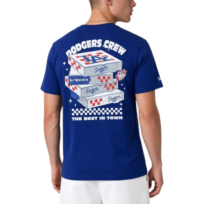 Load image into Gallery viewer, A man wearing a royal blue Los Angeles Dodgers crew-neck t-shirt, viewed from the back. The shirt features a large graphic print of stacked Dodgers-branded shipping boxes with 'DODGERS CREW' written above and 'THE BEST IN TOWN' below.
