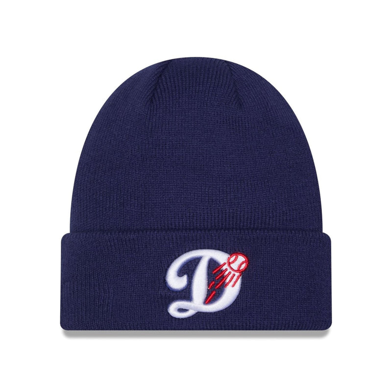 Load image into Gallery viewer, A navy blue ribbed knit beanie hat featuring a white embroidered script letter 'D' with a red baseball design on the front cuff, set against a plain white background.
