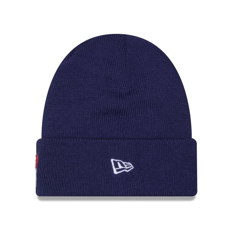 Load image into Gallery viewer, A navy blue ribbed knit beanie hat with a white embroidered New Era flag logo on the front cuff, shown against a plain white background.
