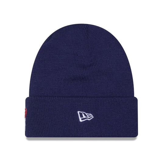 A navy blue ribbed knit beanie hat with a white embroidered New Era flag logo on the front cuff, shown against a plain white background.