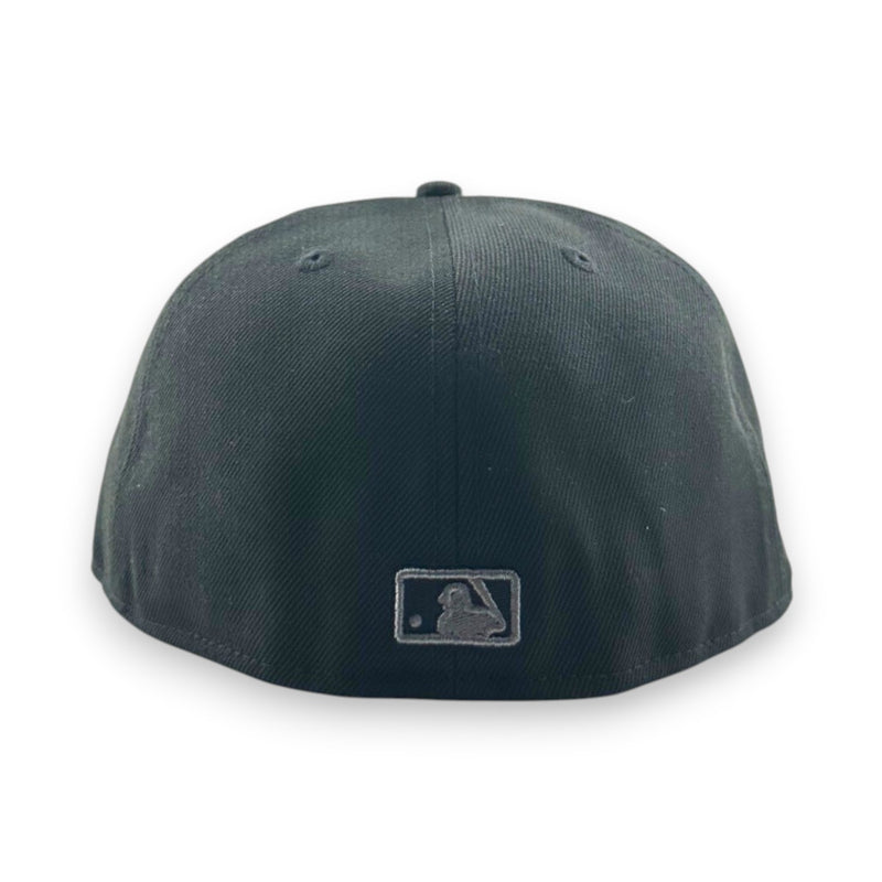 Load image into Gallery viewer, Black baseball cap with a MLB logo on the back against a white background
