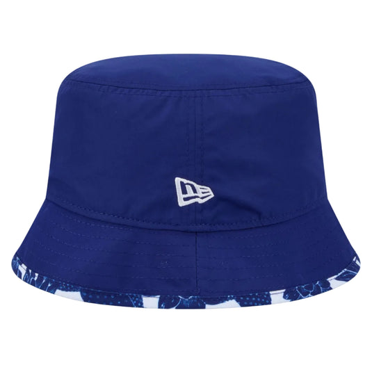 A royal blue New Era bucket hat with a white embroidered logo on the front and a blue and white patterned brim edge, shown against a plain white background.