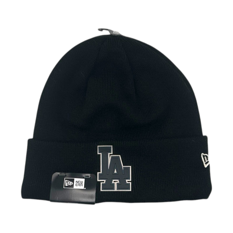 Load image into Gallery viewer, A black knit beanie hat featuring a large gray and white embroidered 'LA' logo on the front cuff, a small white New Era flag logo on the side, and a black hangtag attached to the front.
