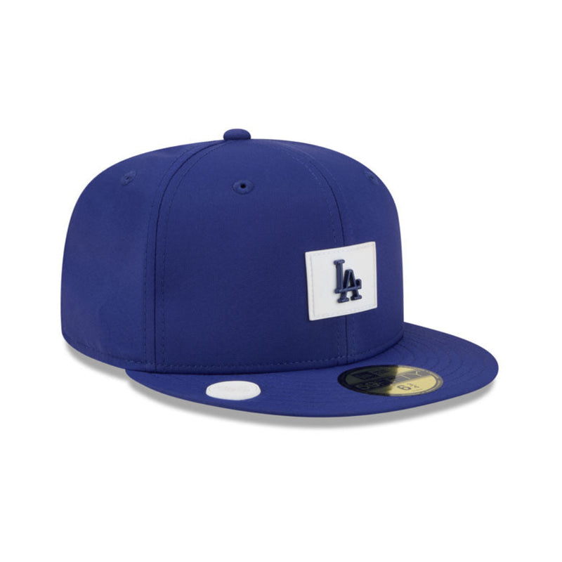 Load image into Gallery viewer, Blue cap with a front silicone team patch on a white background
