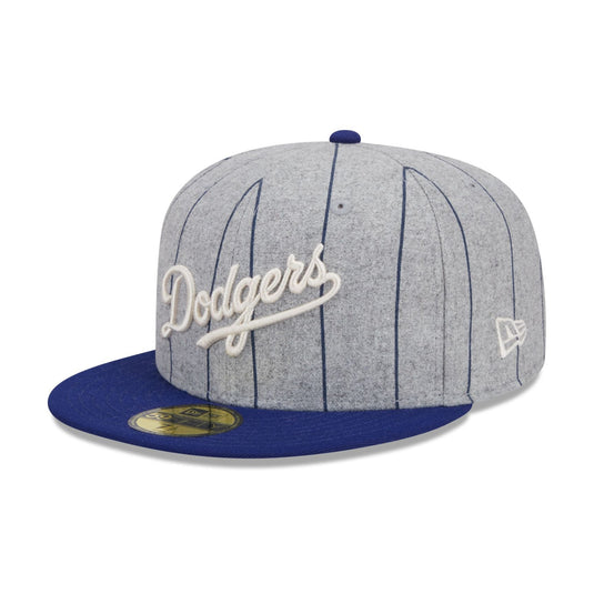 Gray and blue baseball cap with 'Dodgers' logo on a white background
