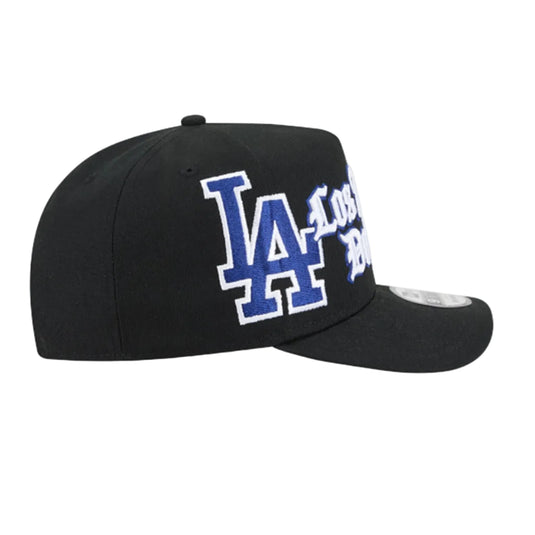 A black baseball cap featuring a blue and white embroidered 'LA' logo with 'Los Angeles' text on the front, shown against a plain white background.