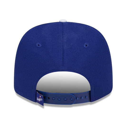 Blue baseball cap with a white brim on a white background