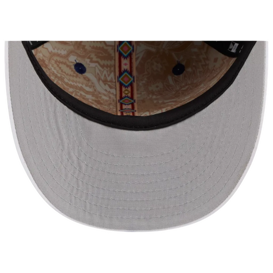 Close-up of a gray undervisor with a patterned interior and brand logo.
