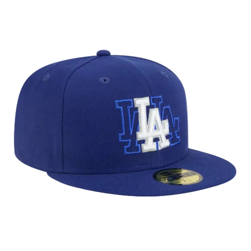 Load image into Gallery viewer, Blue dodgers cap with a triple logo embroidered on the front on a white background 
