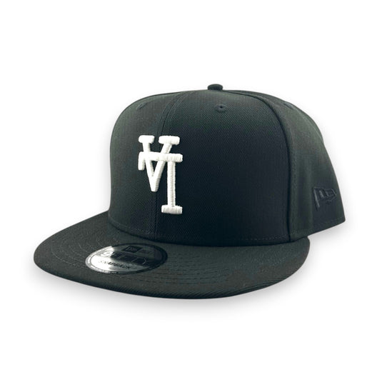 Black cap with a white upside down 'LA' logo on a white background