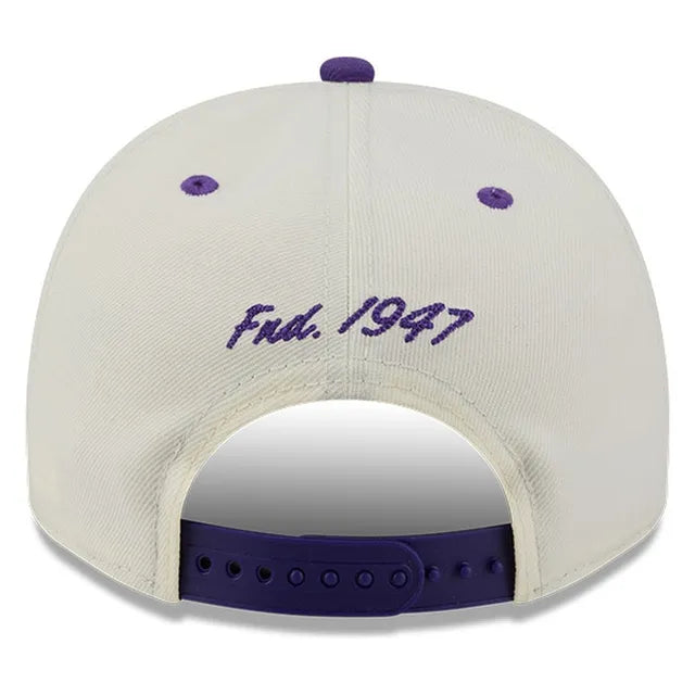 Load image into Gallery viewer, Back view of a white baseball cap with purple embroidery reading 'Fnd. 1947' and purple adjustable strap.
