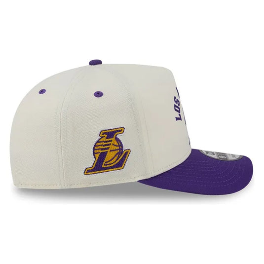 A white and purple Los Angeles Lakers baseball cap with a purple visor, featuring the Lakers logo on the front and a New Era 9FIFTY sticker on the side.