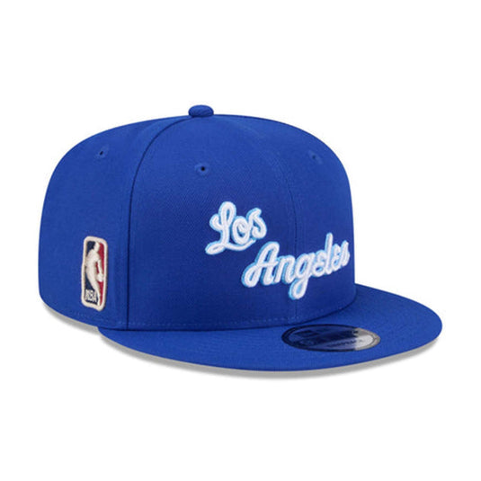 Blue baseball cap with 'Los Angeles' text and NBA logo on a white background