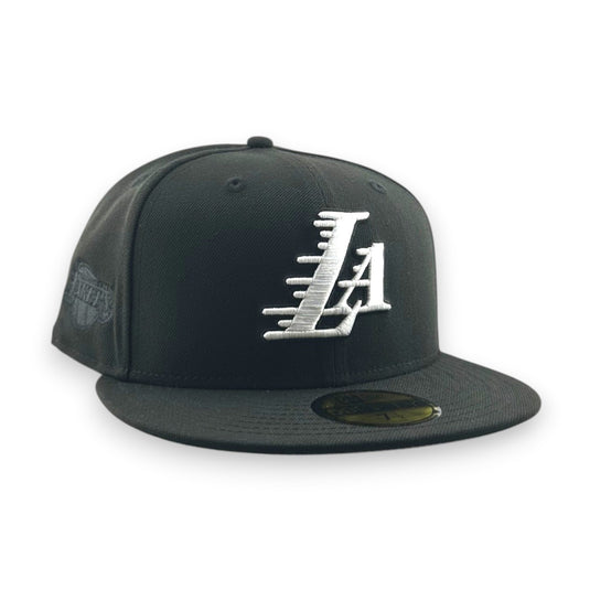 Black cap with white 'LA' logo on a white background