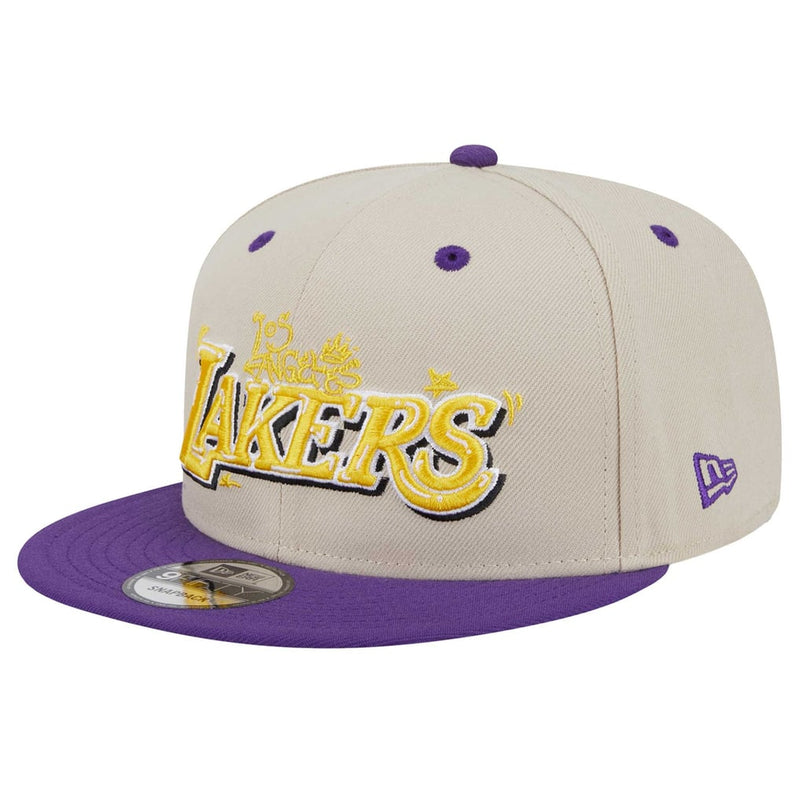 Load image into Gallery viewer, A beige and purple Los Angeles Lakers fitted cap by New Era, featuring a gold, purple, and black embroidered 'Lakers' logo on the front and a purple New Era logo on the side.
