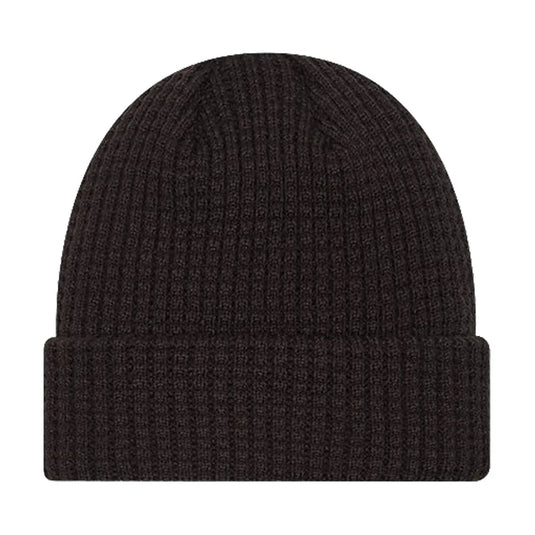 Back side of a black waffle knit cuffed beanie